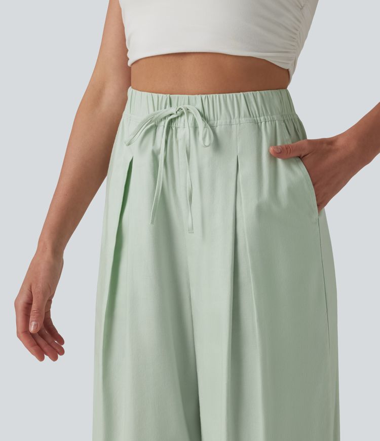 Pantalon casual court en coton et lin taille haute coupe ballon avec cordon de serrage et poches