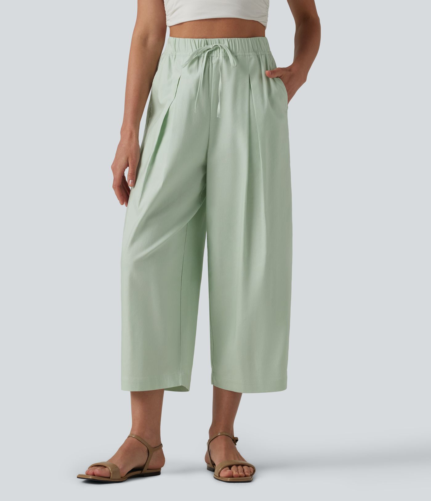 Pantalon casual court en coton et lin taille haute coupe ballon avec cordon de serrage et poches