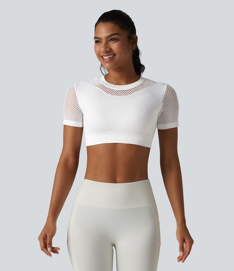 OneForm Seamless Flow - Top deportivo corto con cuello redondo, mangas cortas y diseño con aberturas.