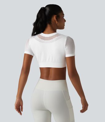 OneForm Seamless Flow - Top deportivo corto con cuello redondo, mangas cortas y diseño con aberturas.