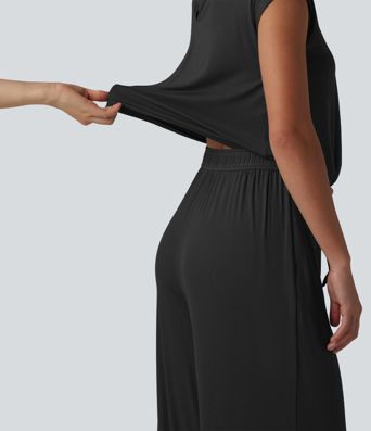 V-hals ermeløs, avslappet jumpsuit med snøring og lommer — Easy Peezy
