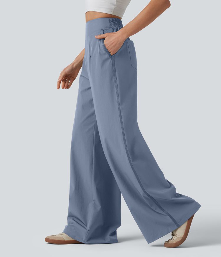 Lässige Hose mit hohem Bund, mehreren Taschen und weitem Bein Lässige Hose mit hohem Bund, mehreren Taschen und weitem Bein