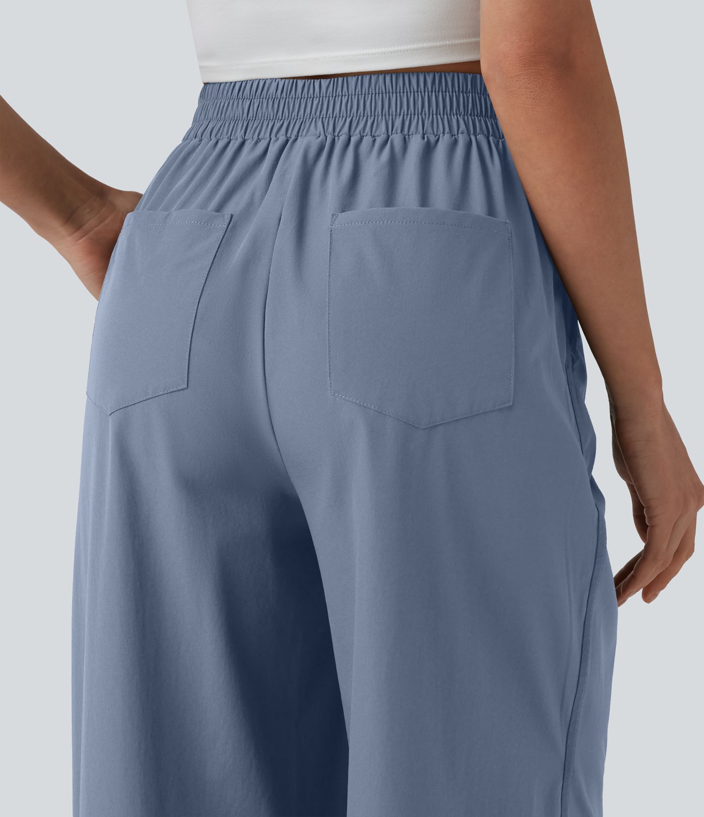 Lässige Hose mit hohem Bund, mehreren Taschen und weitem Bein Lässige Hose mit hohem Bund, mehreren Taschen und weitem Bein
