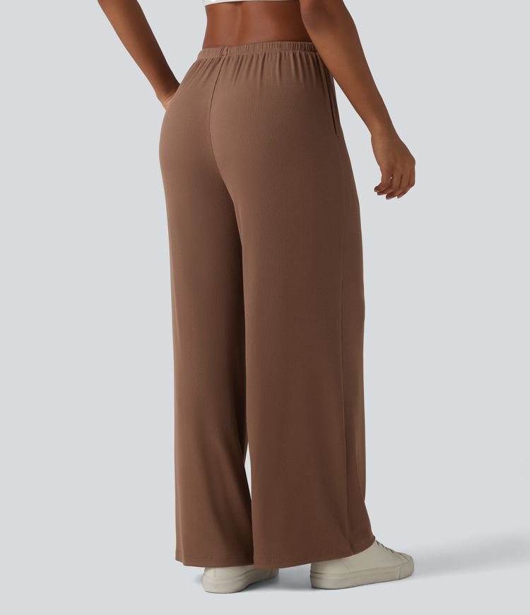 Pantaloni casual larghi in maglia a coste ad alta elasticità, vita media, con coulisse e tasche.