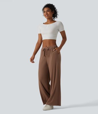 Pantaloni casual larghi in maglia a coste ad alta elasticità, vita media, con coulisse e tasche.