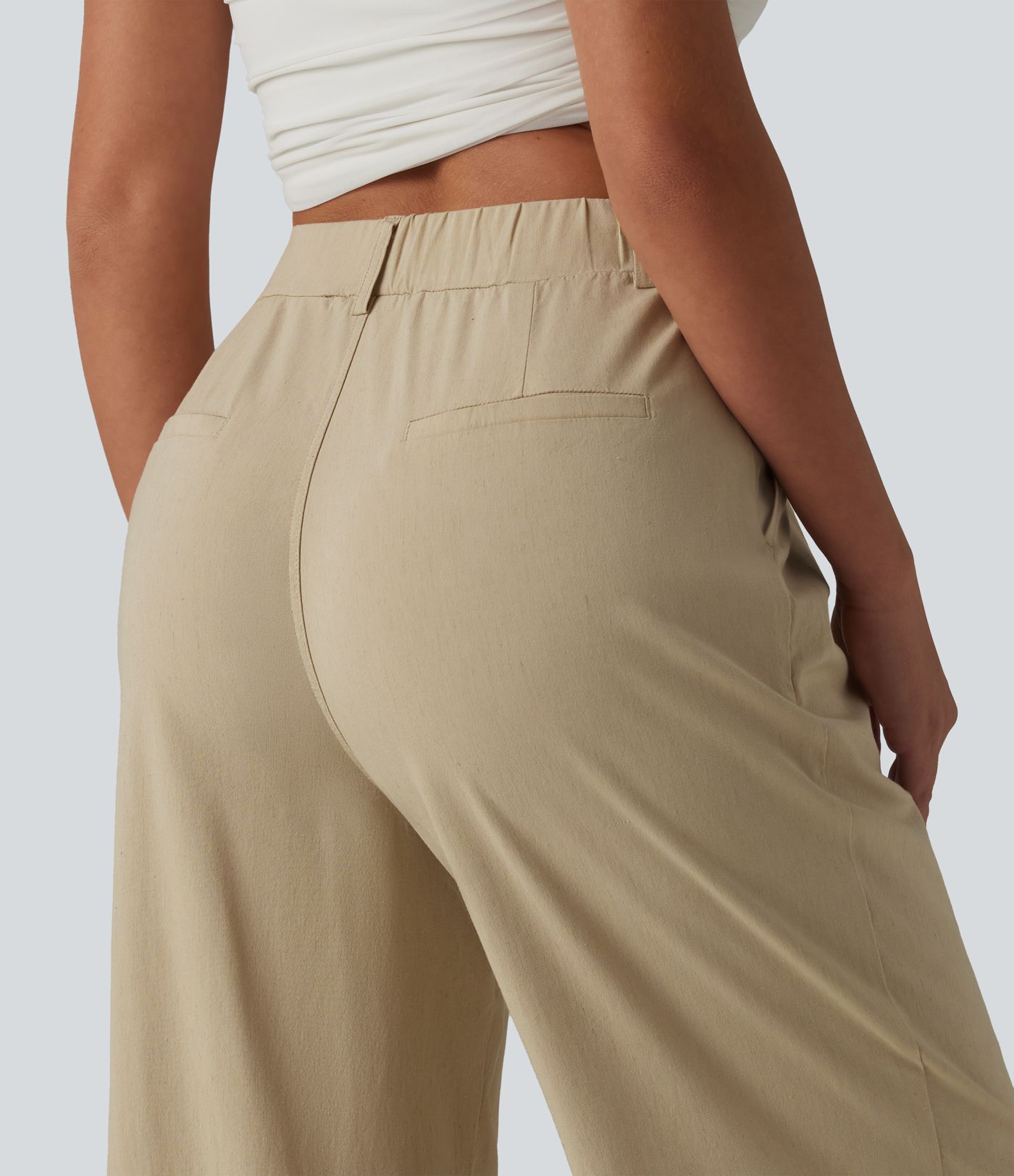 Casual trousers made of stretchy linen with a high waist, side pockets and a straight leg