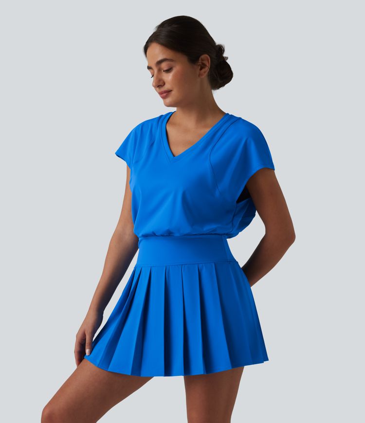 Robe sport de tennis mini 2-en-1 à col V, manches courtes et ourlet plissé avec fermeture éclair invisible et poches