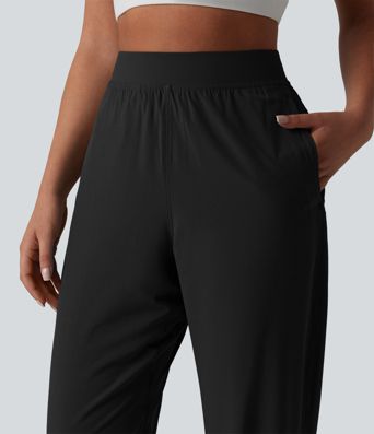 2-in-1 Lauf-Joggers mit hohem Bund, mehreren Taschen, Kordelzug und Reißverschluss - schnelltrocknend 2-in-1 Lauf-Joggers mit hohem Bund, mehreren Taschen, Kordelzug und Reißverschluss - schnelltrocknend