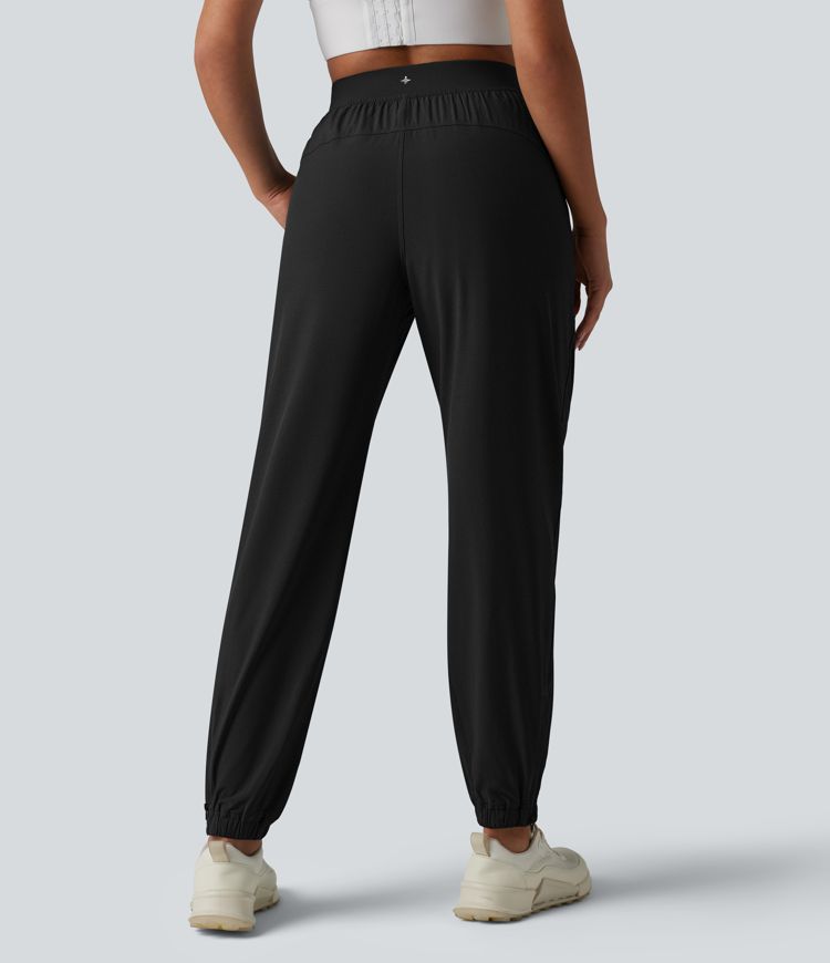 2-in-1 Lauf-Joggers mit hohem Bund, mehreren Taschen, Kordelzug und Reißverschluss - schnelltrocknend 2-in-1 Lauf-Joggers mit hohem Bund, mehreren Taschen, Kordelzug und Reißverschluss - schnelltrocknend