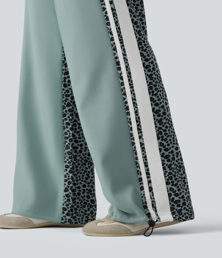 Lässige Baggy-Hose mit mittelhohem Bund, mehreren Taschen, Kordelzug, Streifen und Leopardenmuster Lässige Baggy-Hose mit mittelhohem Bund, mehreren Taschen, Kordelzug, Streifen und Leopardenmuster