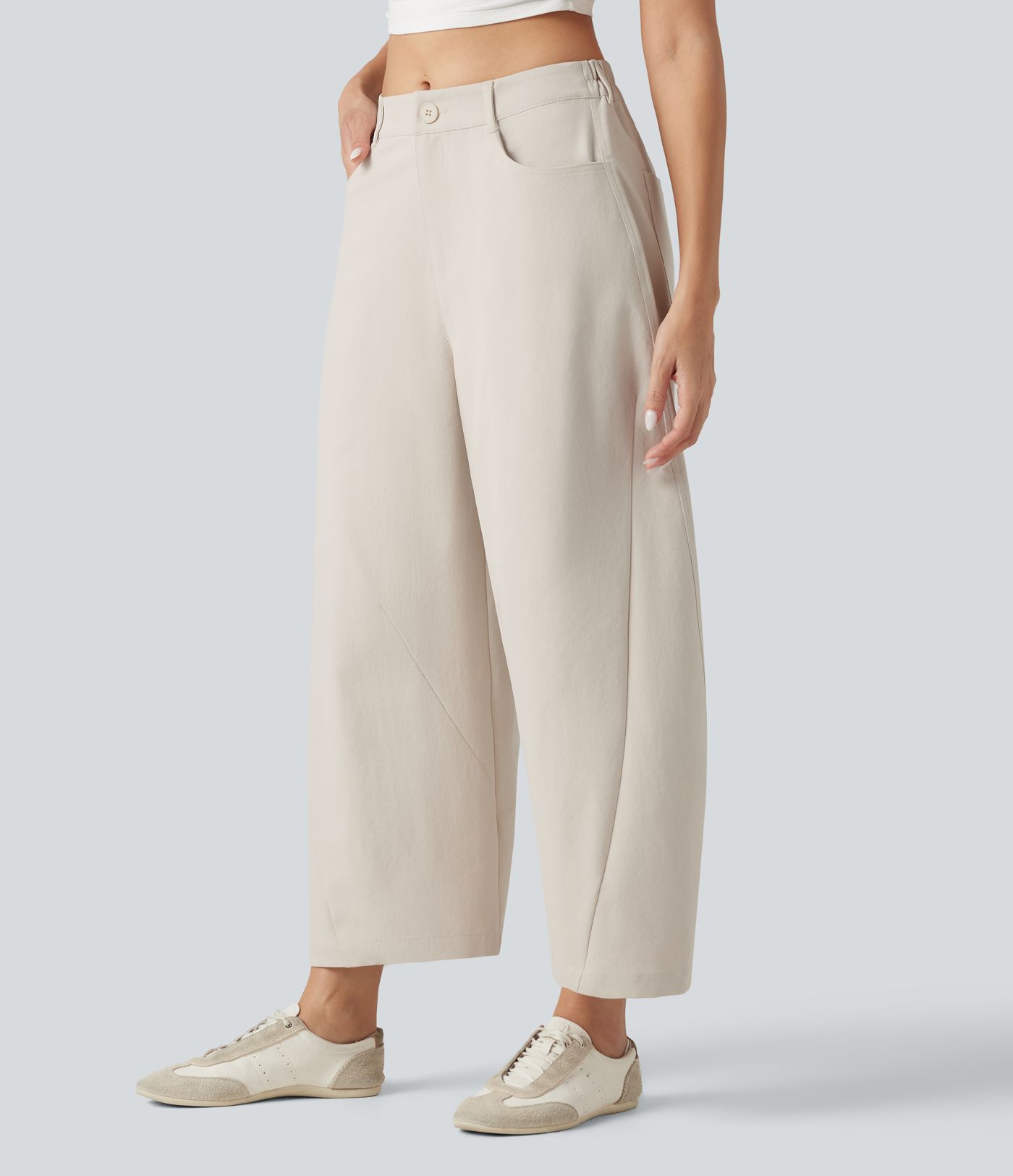 Pantalon décontracté à taille mi-haute, coupe ample et jambes fuselées, avec poches