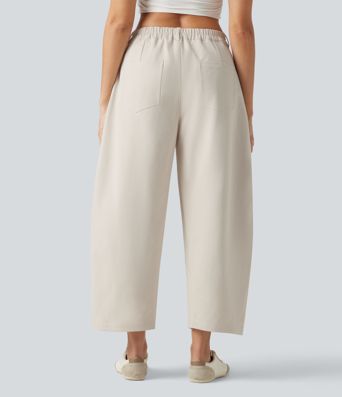 Pantalon décontracté à taille mi-haute, coupe ample et jambes fuselées, avec poches