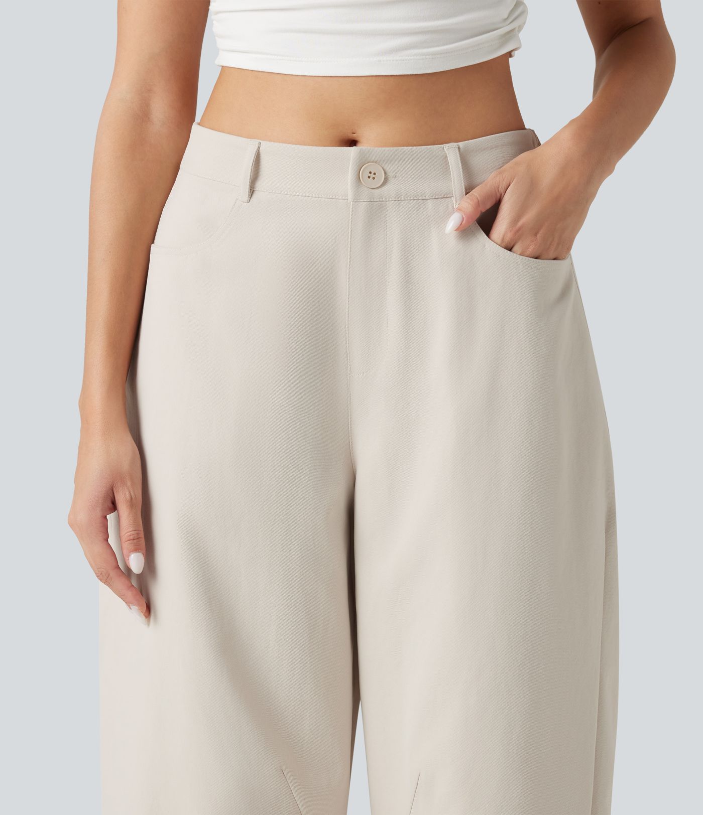 Pantalon décontracté à taille mi-haute, coupe ample et jambes fuselées, avec poches