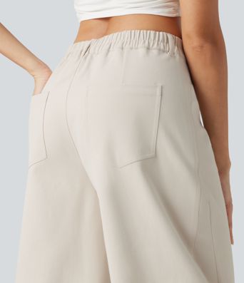 Pantalon décontracté à taille mi-haute, coupe ample et jambes fuselées, avec poches