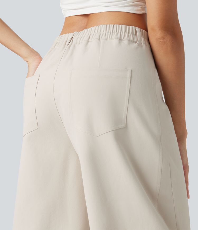 Pantalon décontracté à taille mi-haute, coupe ample et jambes fuselées, avec poches