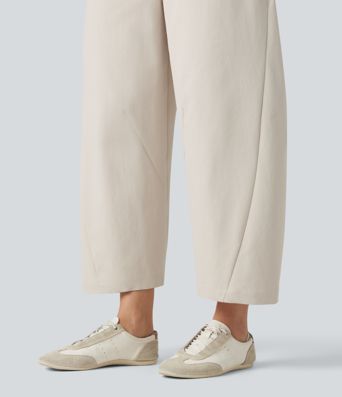 Pantalon décontracté à taille mi-haute, coupe ample et jambes fuselées, avec poches