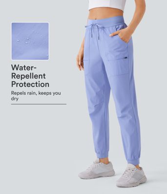 Pantalon de randonnée taille mi-haute, imperméable et résistant à l'abrasion, avec cordon de serrage et poches.