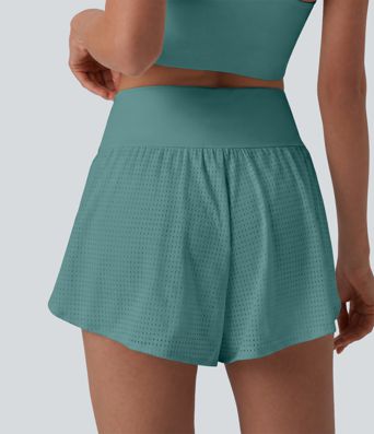 Short yoga 2-en-1 gainant taille haute à pois réfléchissants, ourlet arrondi croisé et œillets avec poches