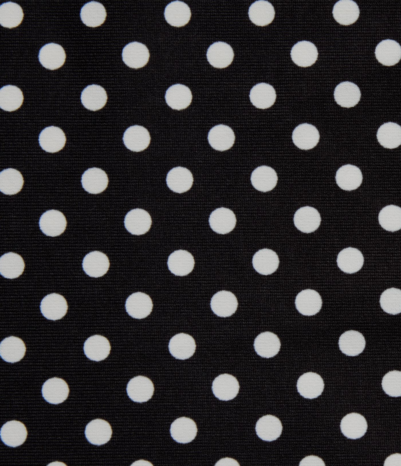 Robe midi fluide et décontractée à pois, sans manches, dos-nu et croisée, avec poches.