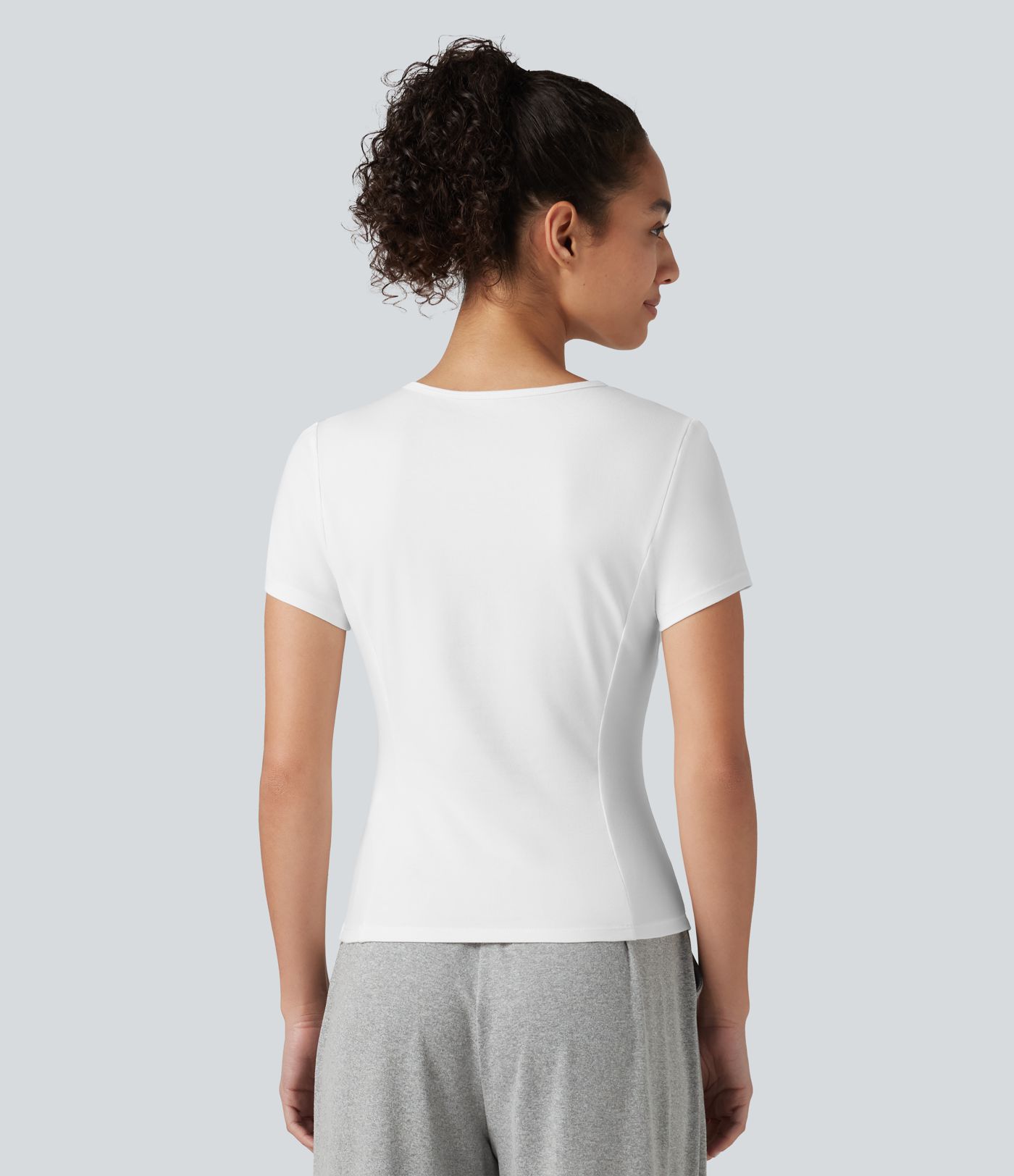 Top deportivo de algodón para correr, cuello redondo, manga corta, con fruncido y bajo asimétrico, de secado rápido