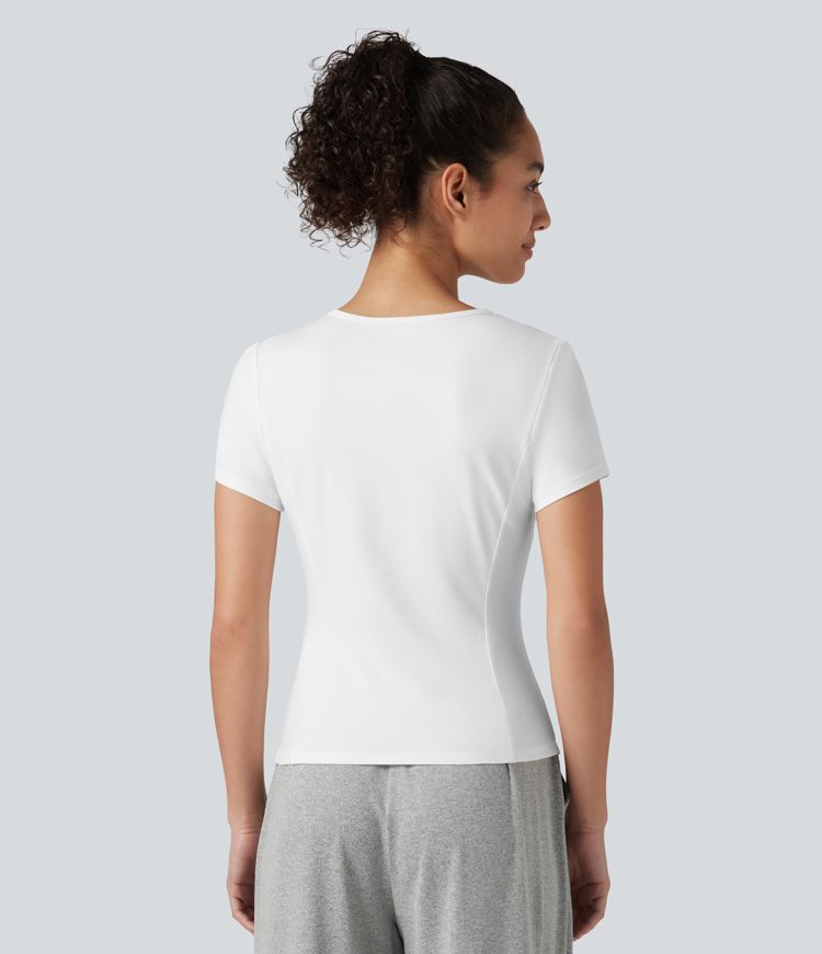 Top deportivo de algodón para correr, cuello redondo, manga corta, con fruncido y bajo asimétrico, de secado rápido