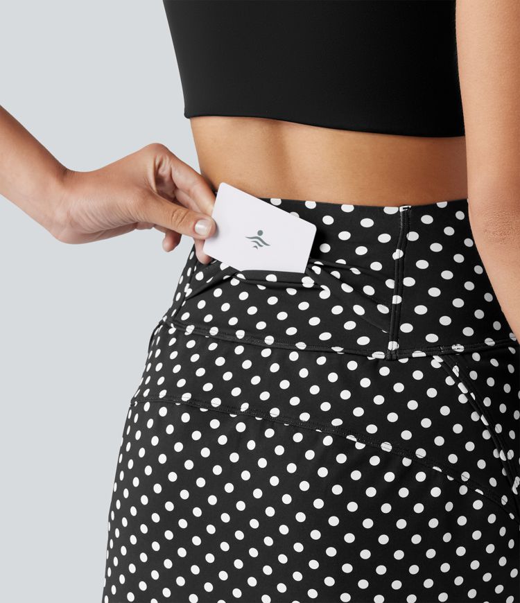 Mini-jupe de golf 2 en 1 à pois, taille ultra haute, effet ventre plat, ourlet arrondi et poches