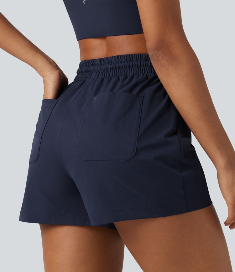 Baggy-Workout-Shorts aus elastischem Popeline mit hohem Bund, mehreren Taschen und Kordelzug