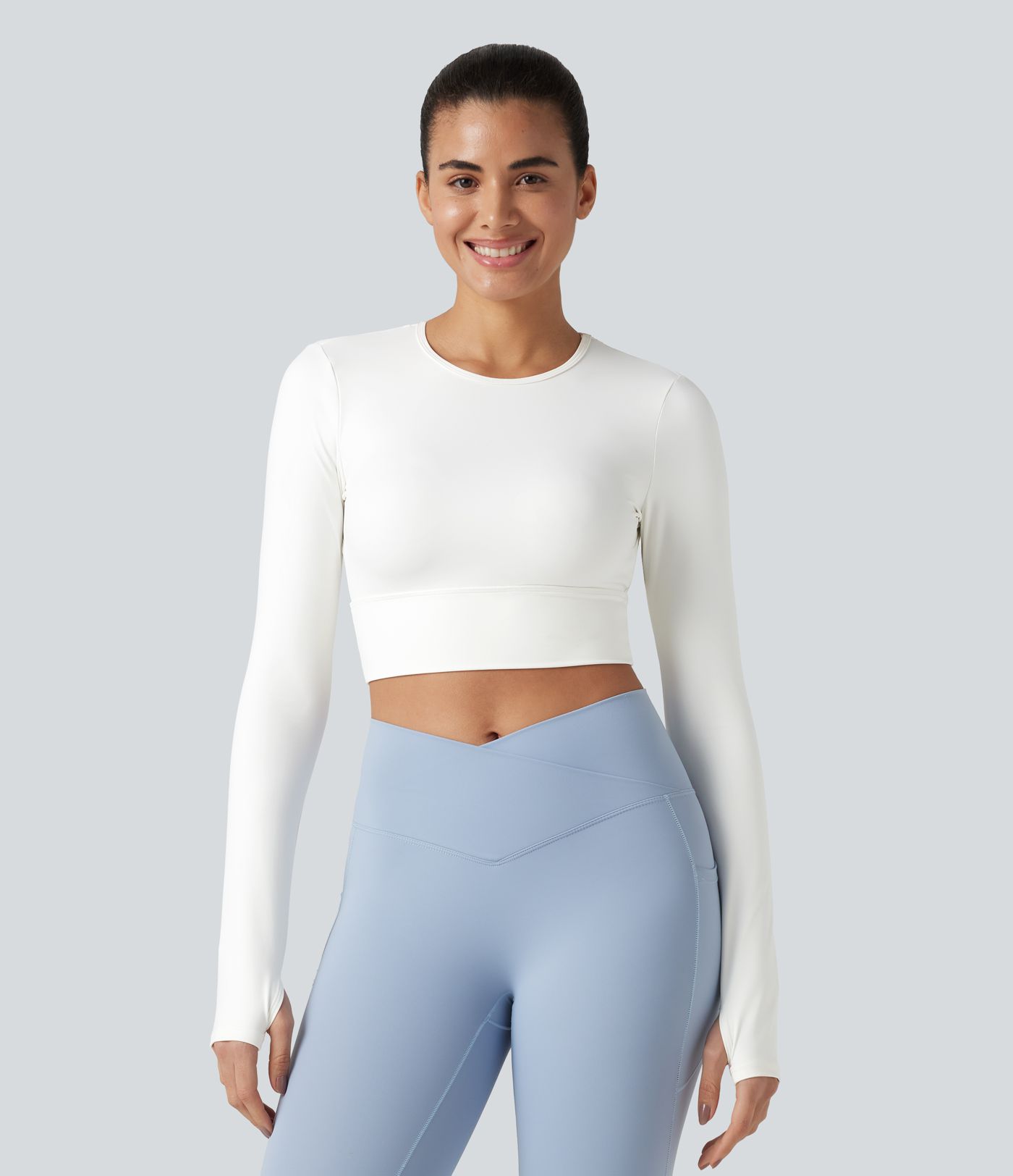 Haut de sport dos nu à manches longues avec passe-pouces, toucher frais, séchage rapide, protection UPF50+ pour le yoga