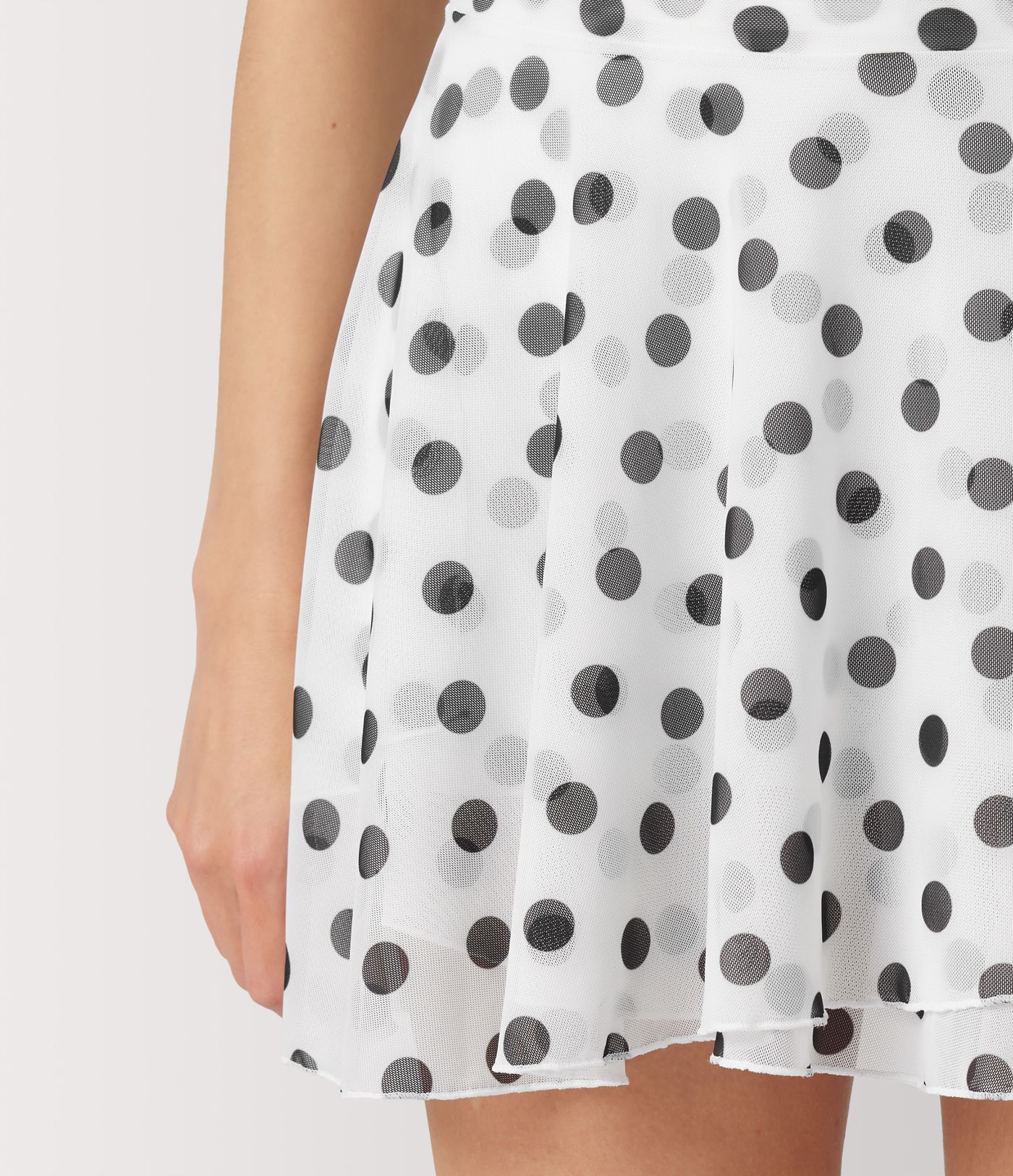 Jupe évasée micro‑mini en résille à pois, taille haute, 2 en 1, à nouer sur le côté, fluide, avec poche