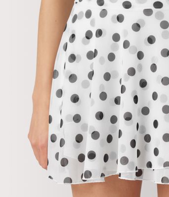 Jupe évasée micro‑mini en résille à pois, taille haute, 2 en 1, à nouer sur le côté, fluide, avec poche