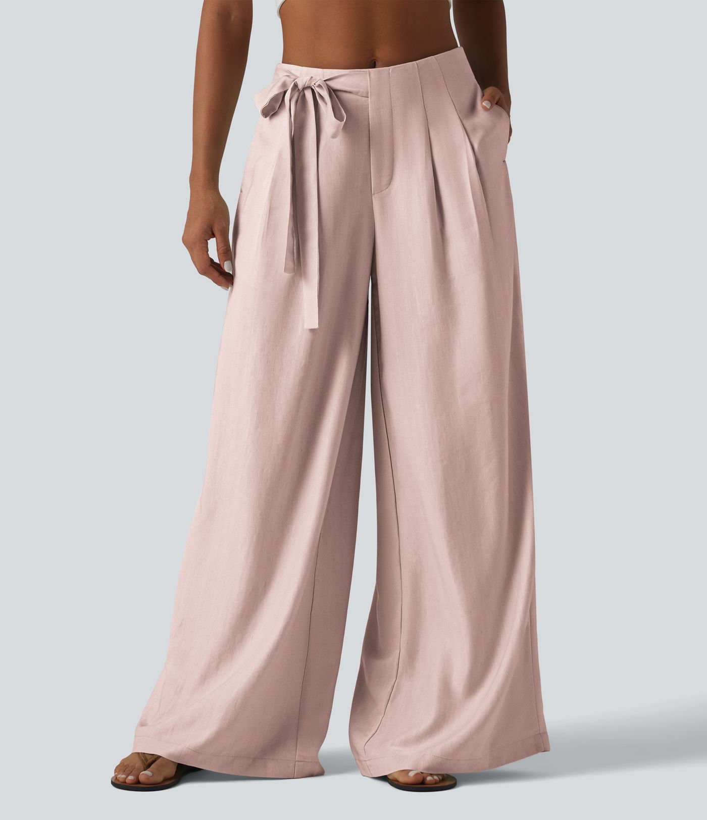 Pantalon large fluide taille haute en lin mélangé avec poches et liens latéraux Pantalon large fluide taille haute en lin mélangé avec poches et liens latéraux