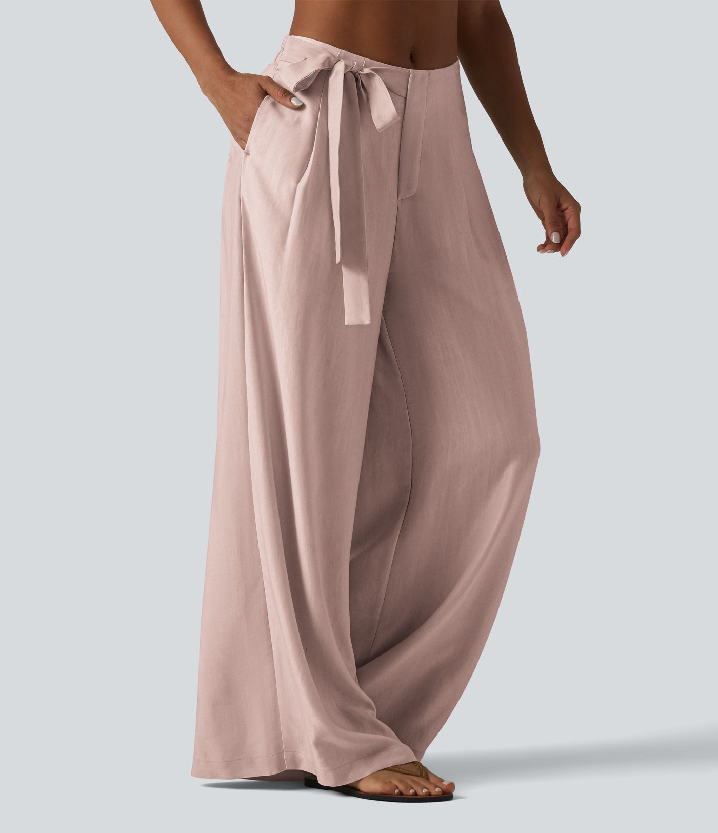 Pantalon large fluide taille haute en lin mélangé avec poches et liens latéraux Pantalon large fluide taille haute en lin mélangé avec poches et liens latéraux