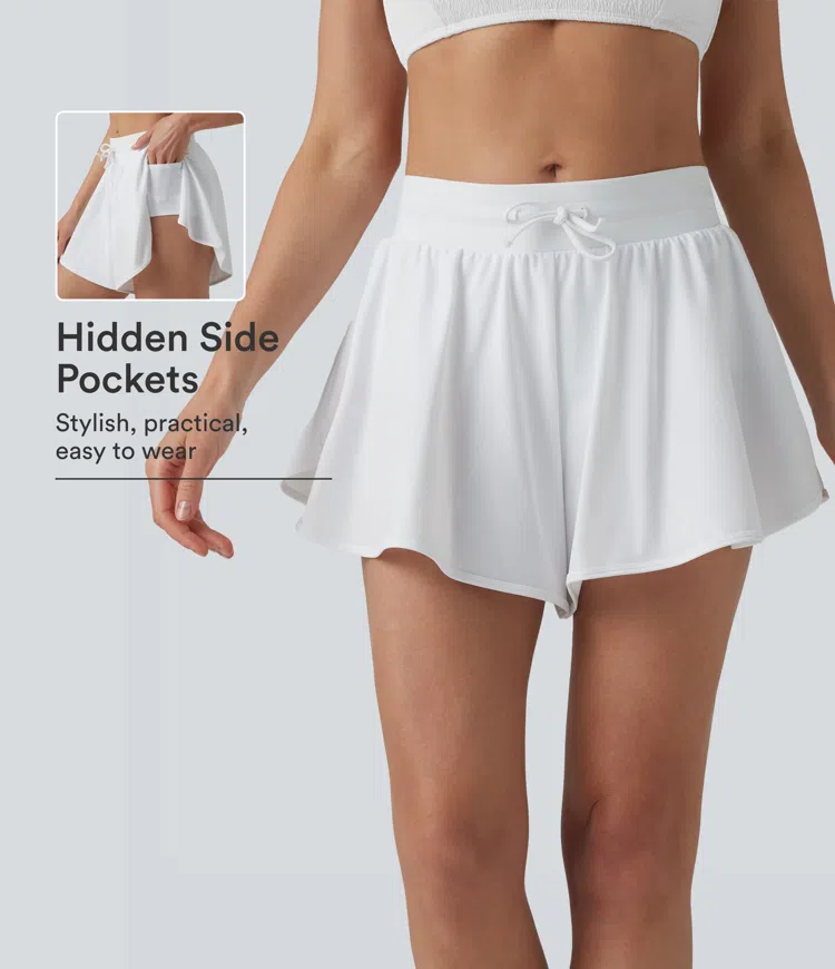 Short de bikini 2-en-1 taille mi‑haute à cordon, fentes latérales et ourlet incurvé, avec poches
