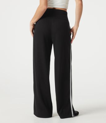 Pantalon baggy décontracté côtelé à taille haute, gainant au niveau du ventre, à cordon de serrage, avec bande latérale et poches.
