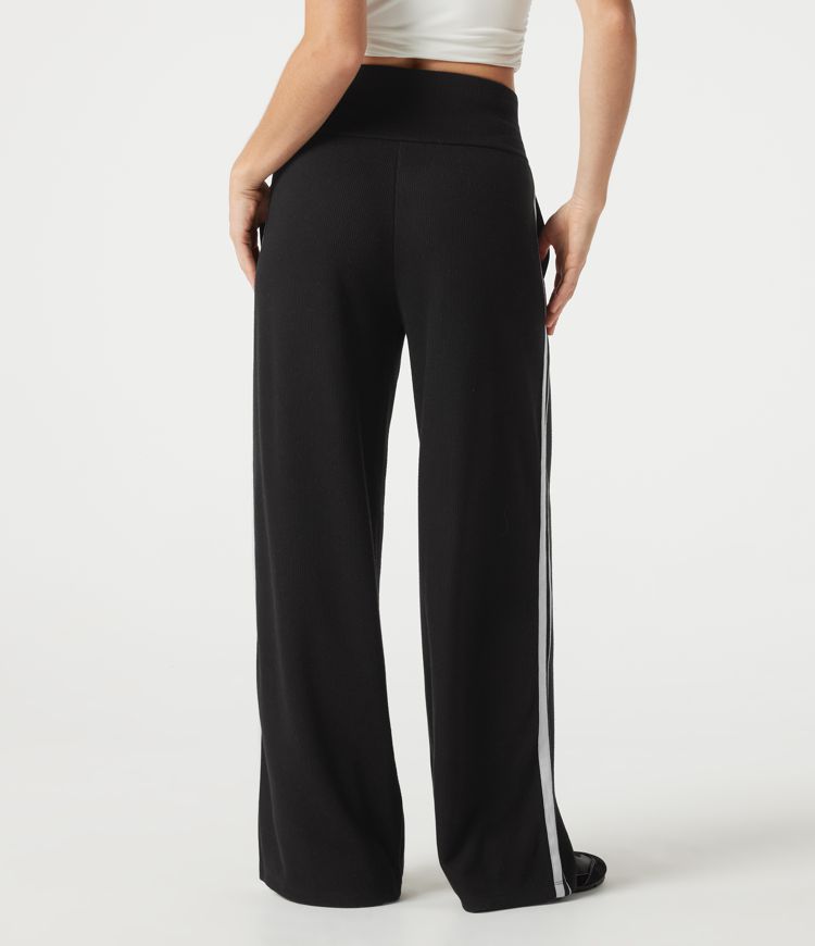 Pantalon baggy décontracté côtelé à taille haute, gainant au niveau du ventre, à cordon de serrage, avec bande latérale et poches.