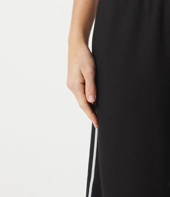 Pantalon baggy décontracté côtelé à taille haute, gainant au niveau du ventre, à cordon de serrage, avec bande latérale et poches.