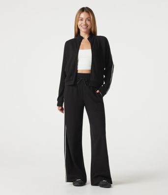 Pantalon baggy décontracté côtelé à taille haute, gainant au niveau du ventre, à cordon de serrage, avec bande latérale et poches.