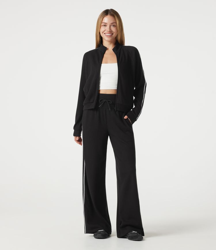 Pantalon baggy décontracté côtelé à taille haute, gainant au niveau du ventre, à cordon de serrage, avec bande latérale et poches.