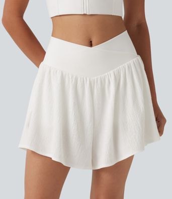 Crossover 2-in-1 Crinkle-Laufshorts mit hohem Bund, seitlichem Saumschlitz und Taschen