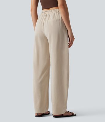 Pantalones de trabajo asimétricos de talle medio con pernera tipo barril, tacto de lino y bolsillos