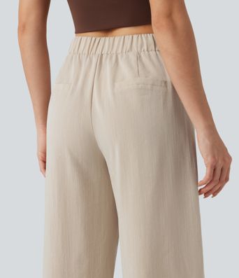 Pantalones de trabajo asimétricos de talle medio con pernera tipo barril, tacto de lino y bolsillos