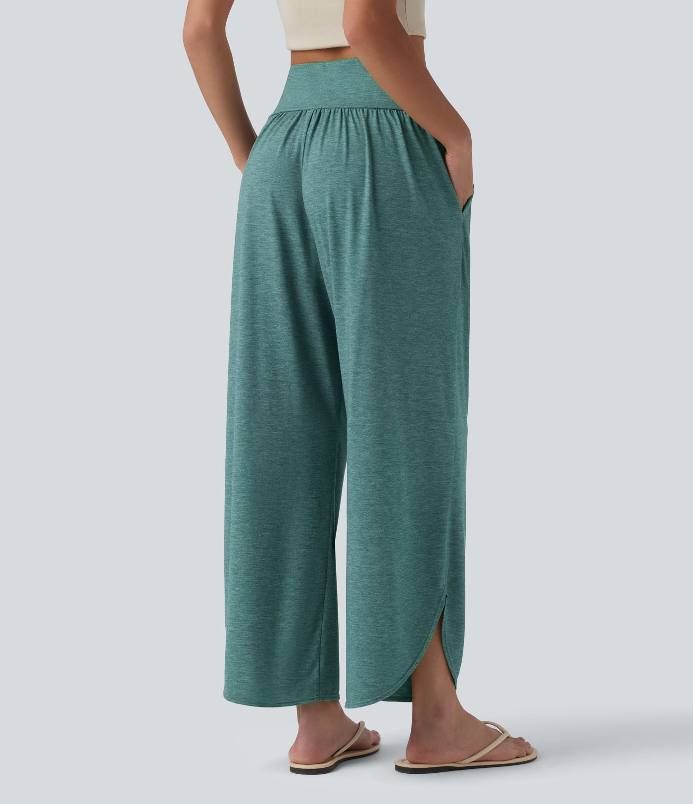 Pantalon décontracté taille haute gainant avec ourlet arrondi et poches