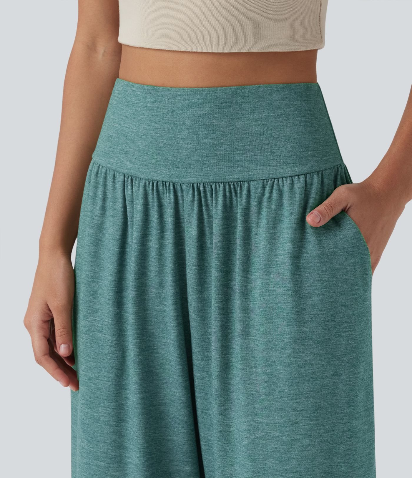 Pantalon décontracté taille haute gainant avec ourlet arrondi et poches