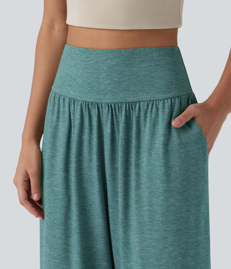 Pantalon décontracté taille haute gainant avec ourlet arrondi et poches