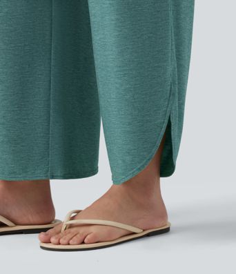 Pantalon décontracté taille haute gainant avec ourlet arrondi et poches