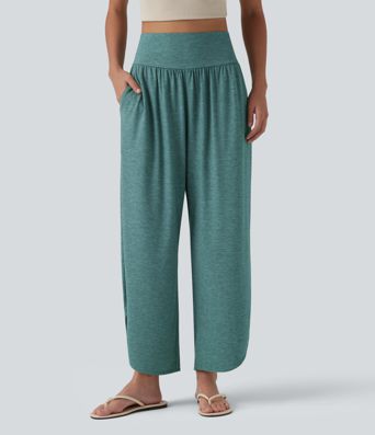 Pantalon décontracté taille haute gainant avec ourlet arrondi et poches