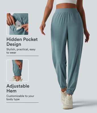 2-in-1 Lauf-Joggers mit hohem Bund, mehreren Taschen, Kordelzug und Reißverschluss - schnelltrocknend 2-in-1 Lauf-Joggers mit hohem Bund, mehreren Taschen, Kordelzug und Reißverschluss - schnelltrocknend