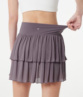 Falda mini de tenis 2 en 1 de malla a capas, cintura alta cruzada, de corte fluido, con bolsillos