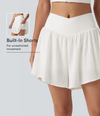 Crossover 2-in-1 Crinkle-Laufshorts mit hohem Bund, seitlichem Saumschlitz und Taschen
