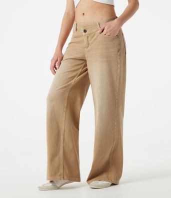 Halara Flex™ jeans décontractés asymétriques, taille basse, à jambe large, délavage coloré, avec poches.